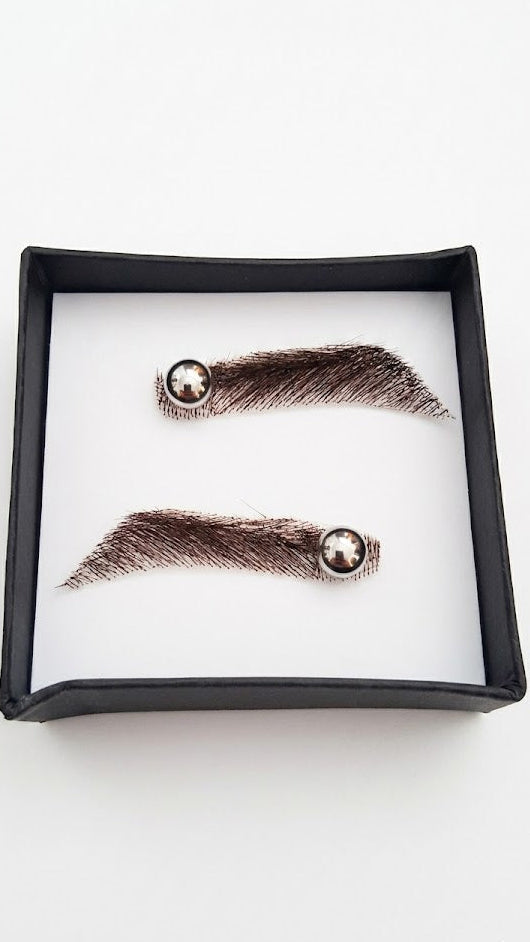 Pair of false eyelashes in a black box on a white background