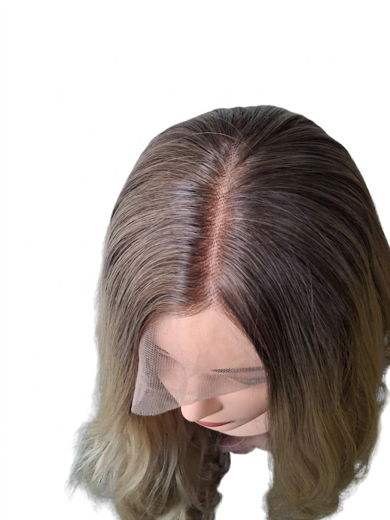 Brown and blonde ombre wig on a mannequin head with a white background