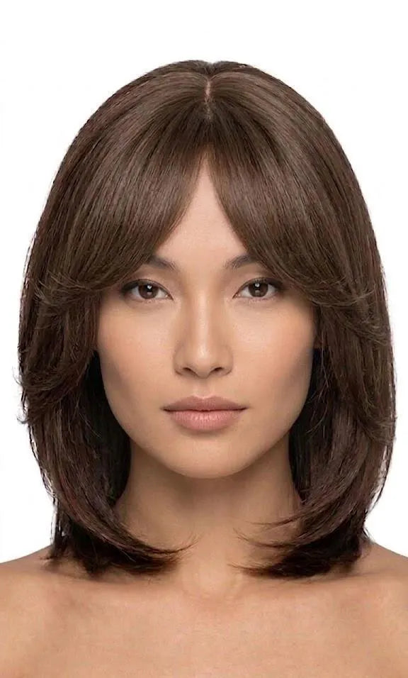 Woman with a styled haircut on a white background