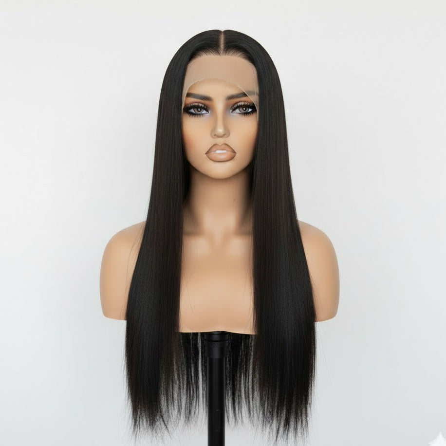 Black straight wig on a mannequin head against a white background