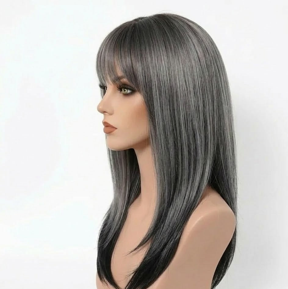 Gray wig on a mannequin head against a white background